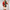Colorful toy soldier figure with a candy cane on a light gray background